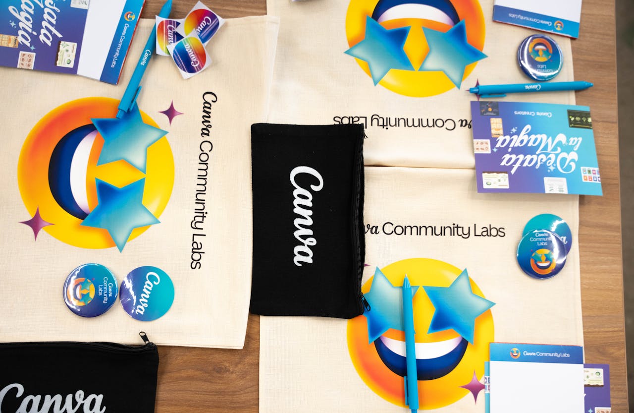 Flat lay of Canva Community Labs merchandise with vibrant design and branding elements.